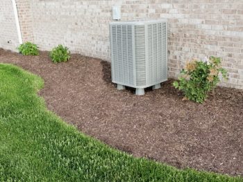 Air Conditioner Condenser Unit Standing Outdoors