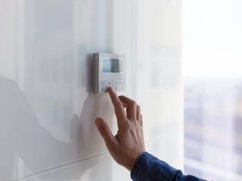 The Air Conditioning And Heating Control Panel For The Apartment And Office Is Located On A White Wall